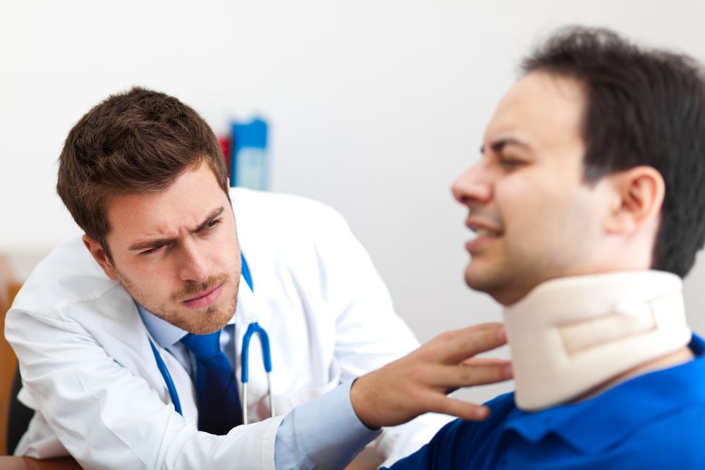 Doctor Examining a Patient | Fort Worth Personal Injury Lawyer | Berenson Injury Law