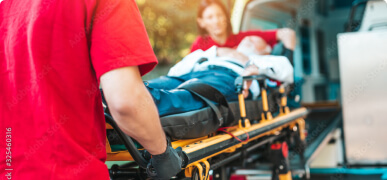 Injured Person assisted by Medical Team | Pedestrian Accidents Attorney | Berenson Injury Law